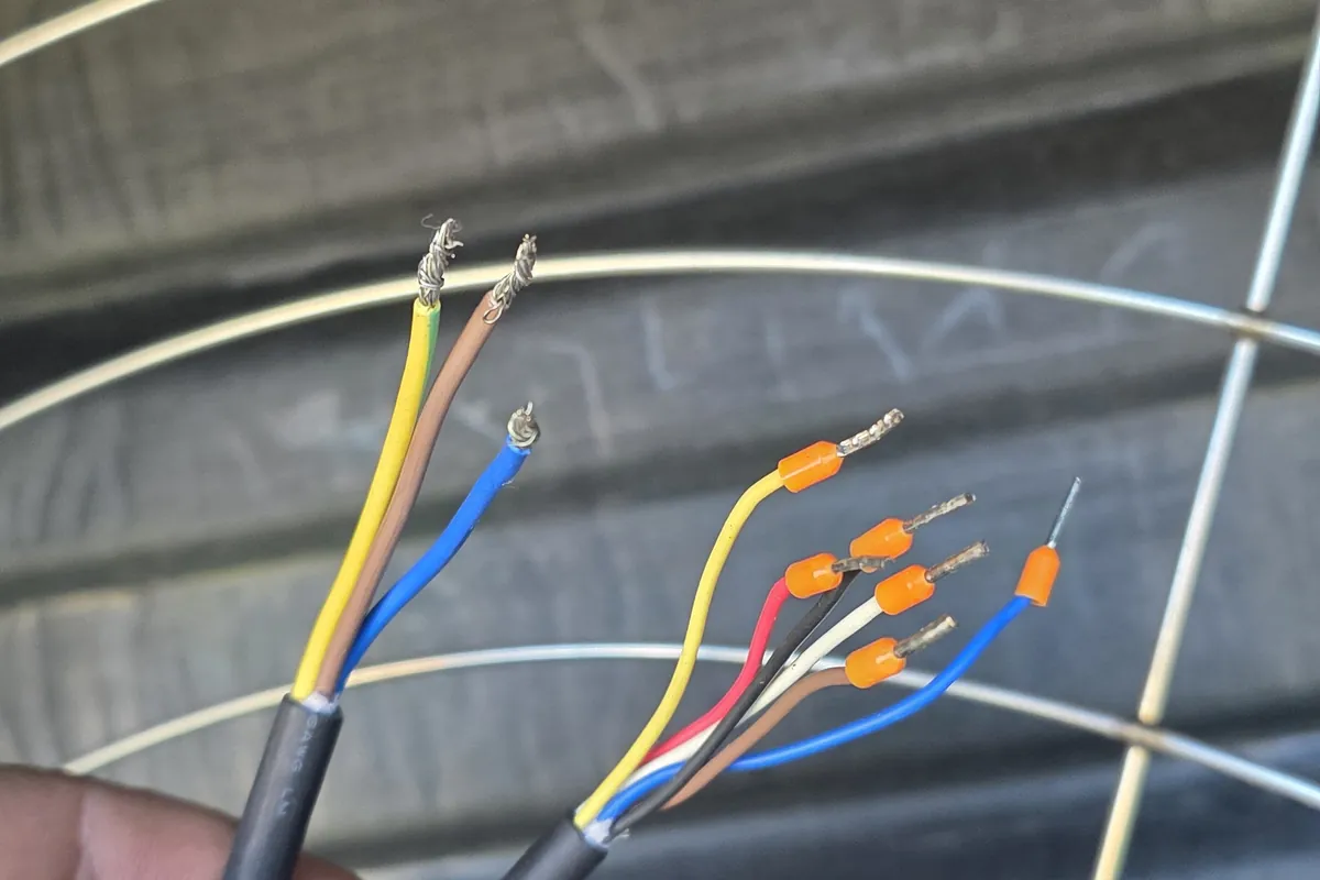 Cable being terminated at farm equipment