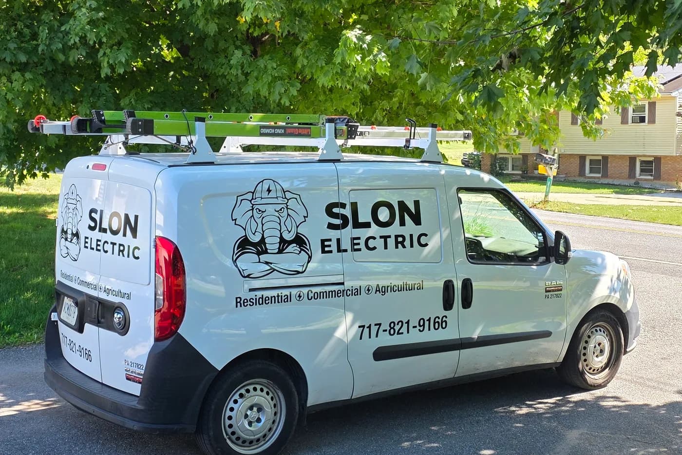 Branded Slon Electric service van with logo and phone number