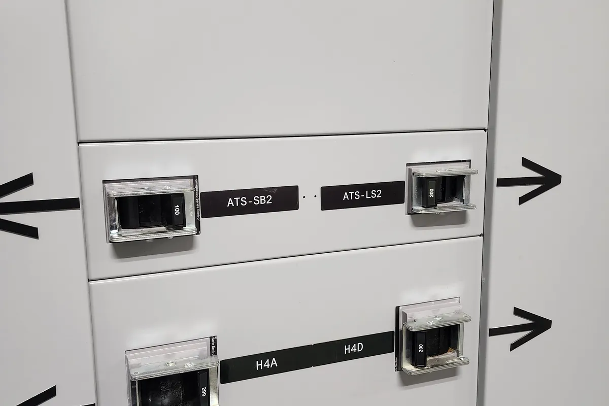 Labelled transfer switches with an arc flash warning label