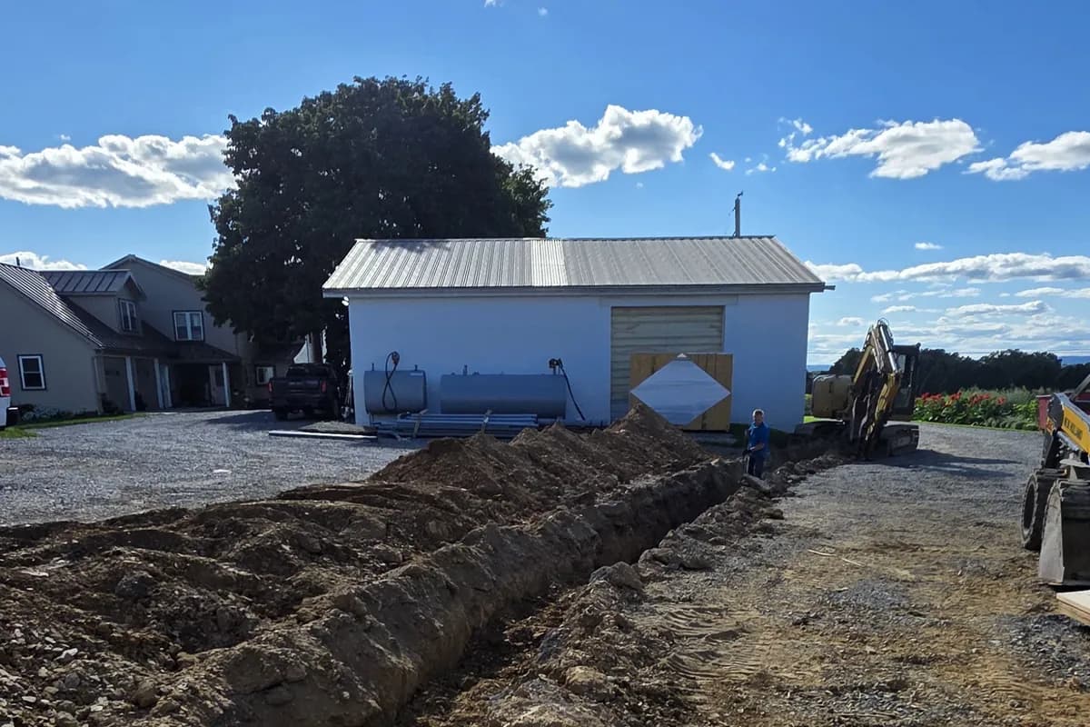 Trenching across a farm yard for the generator supply