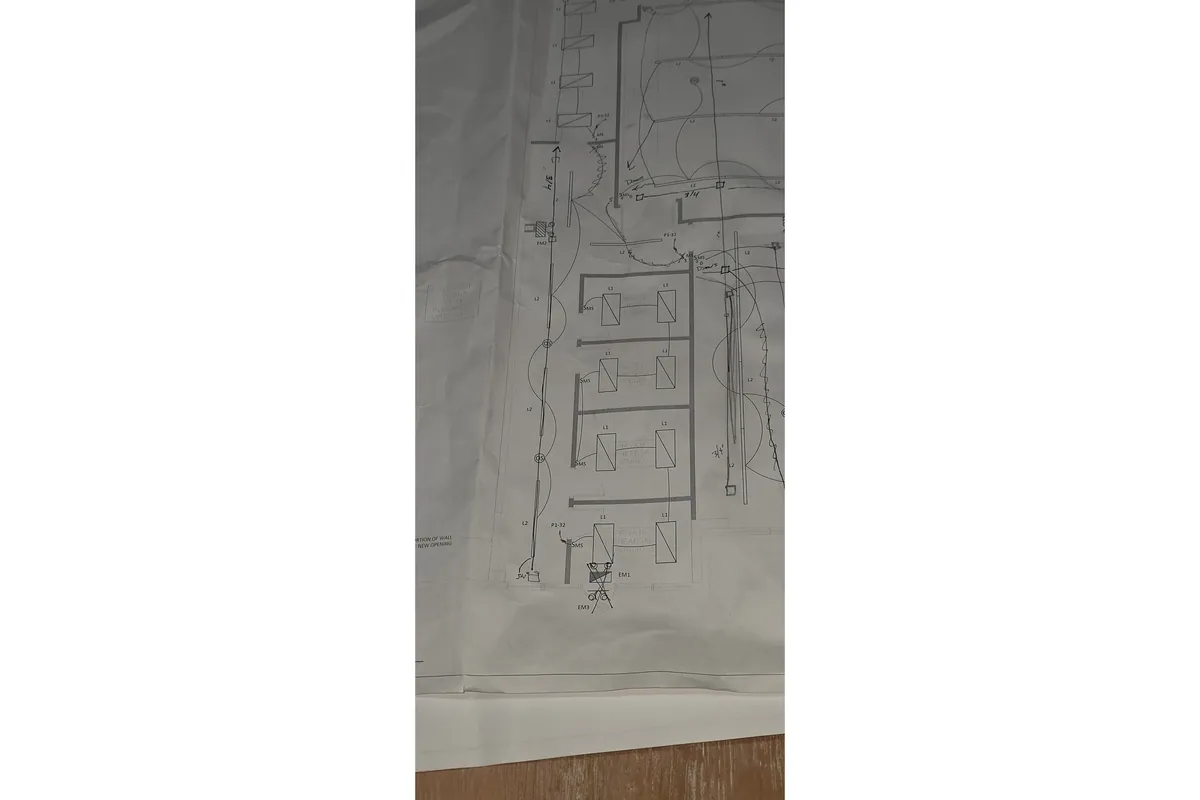 Hand drawn electrical riser diagram on paper