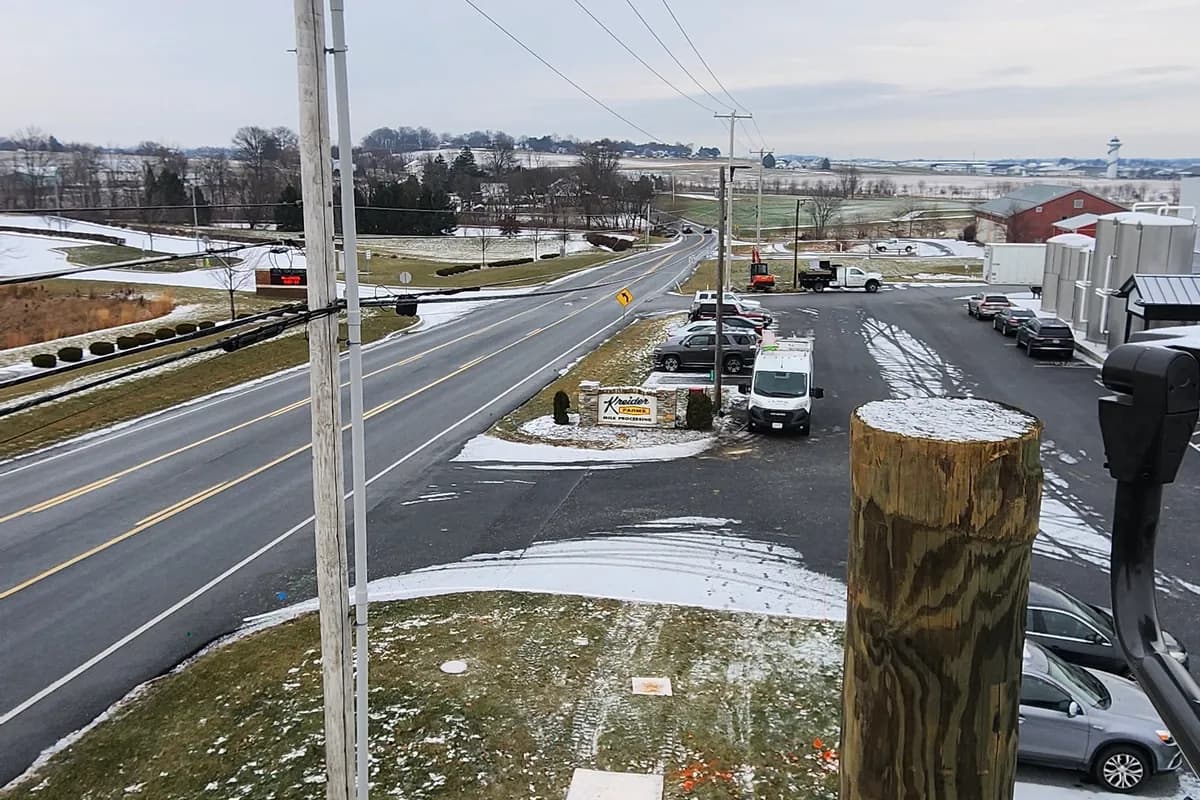 Pole replacement work beside a road in winter