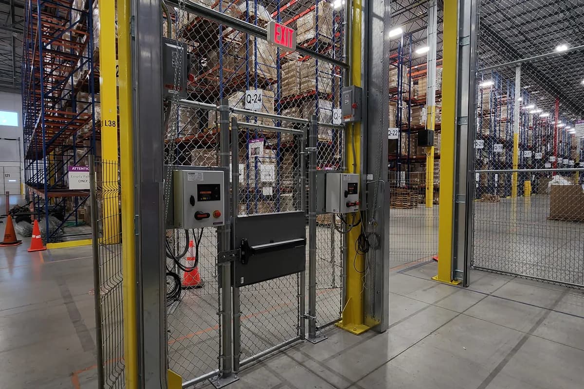 Warehouse interior with pallet racking and yellow guard rails