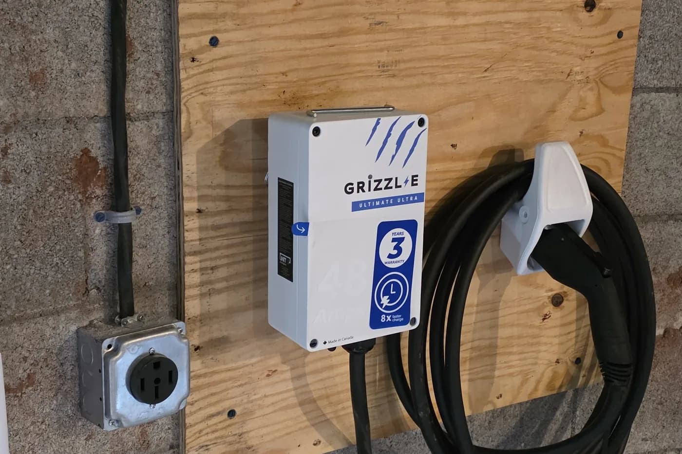 Wall mounted EV charger installed at a commercial site