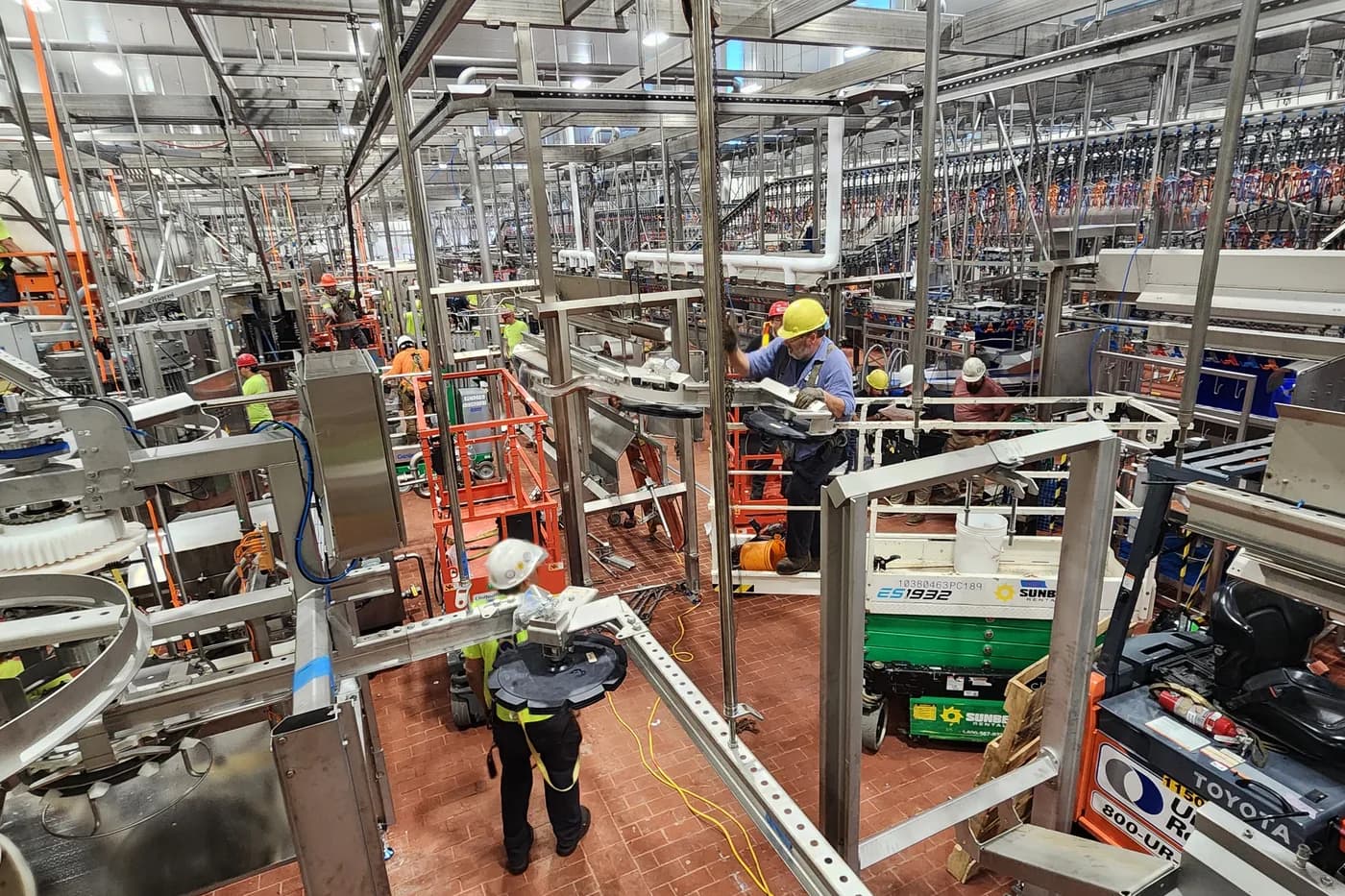 Crews working on food processing equipment inside a Pennsylvania plant